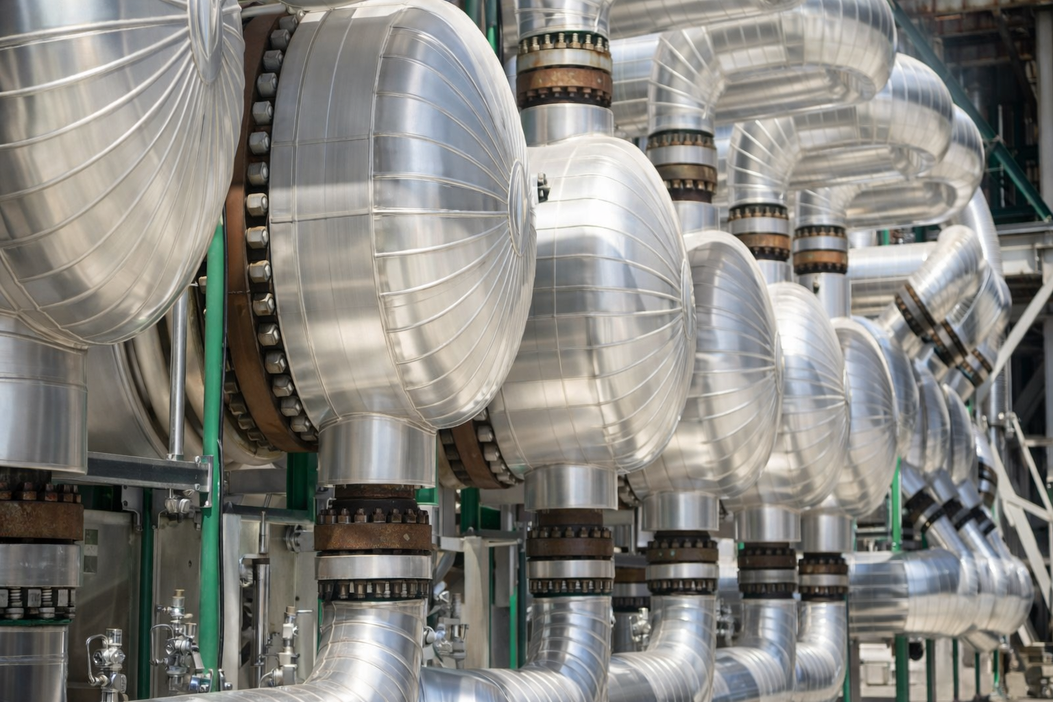 Metal cladding on insulated piping